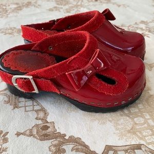 Patent red clogs